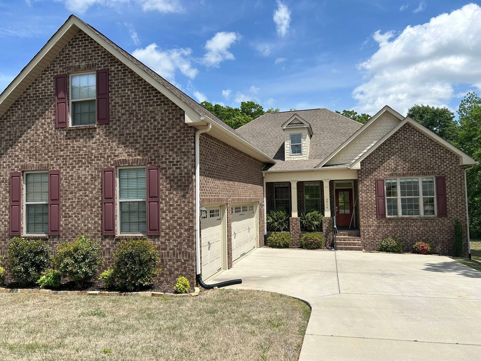 Two-story brick home with clean, streak-free windows in Athens, AL