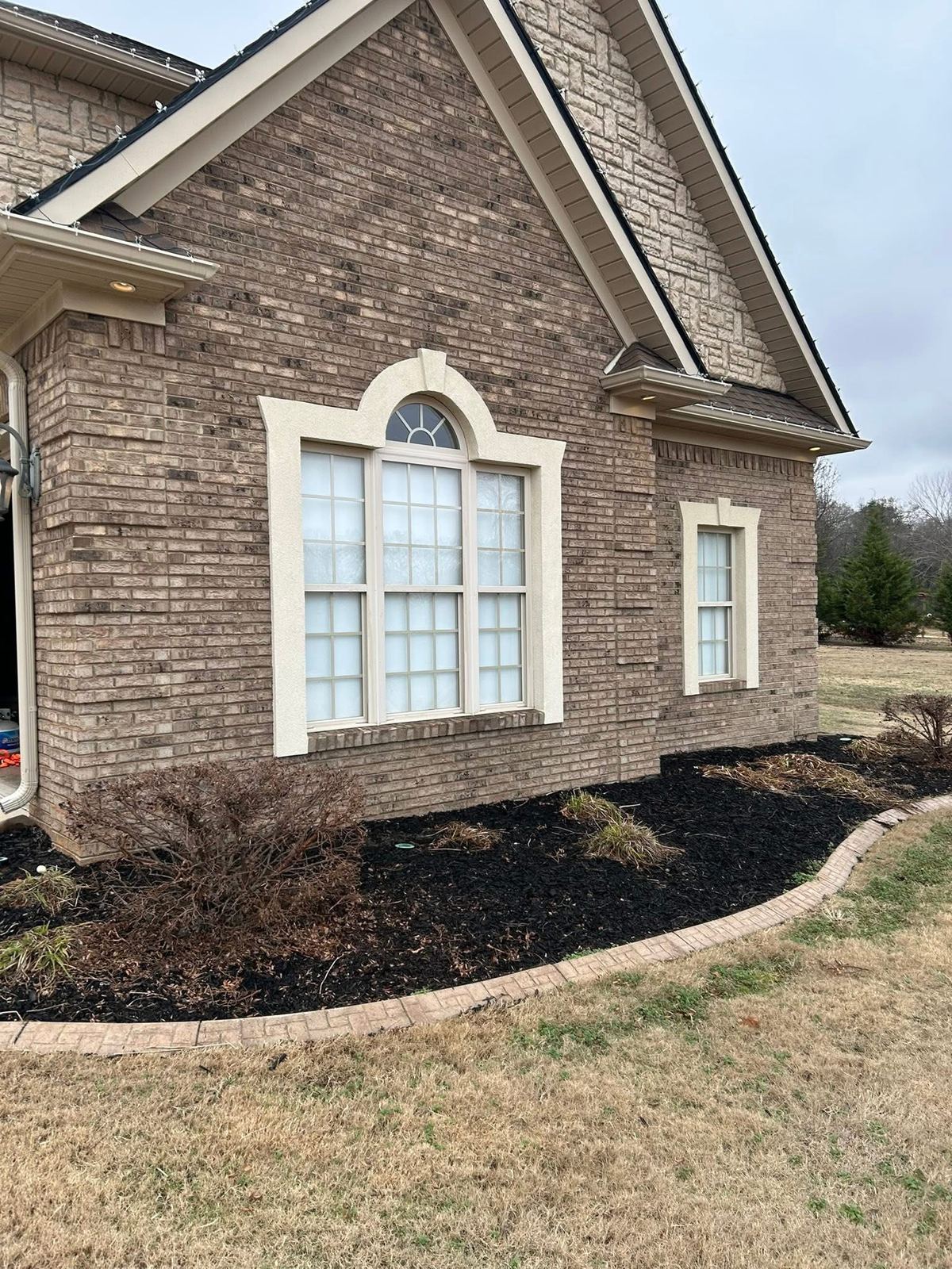Stone home with clean windows, close up